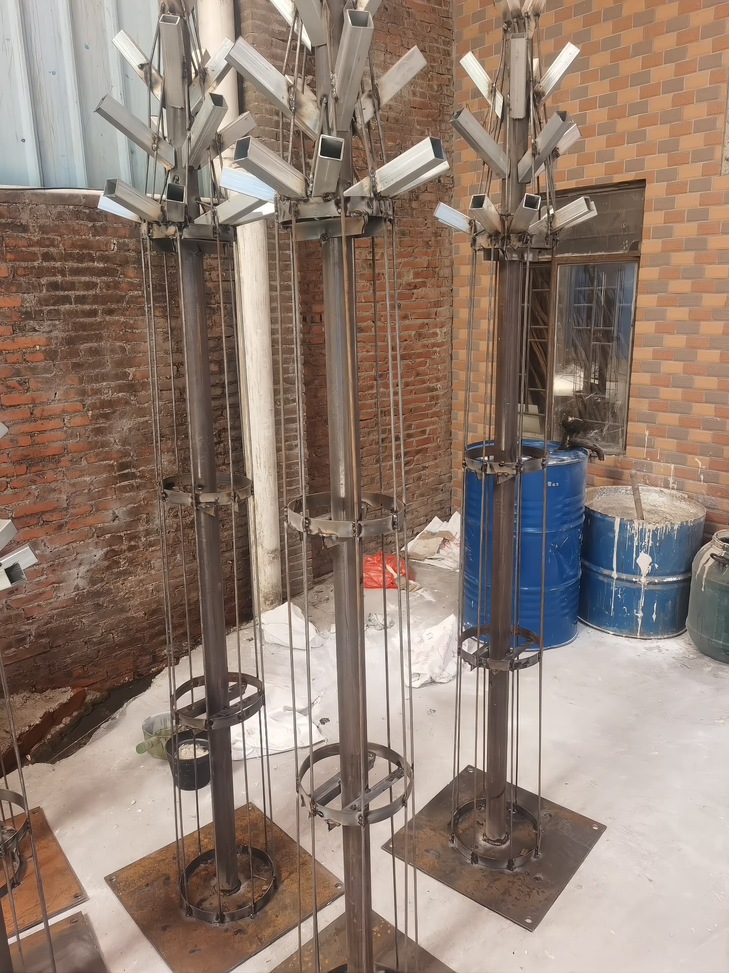 Frame batch: square branch sockets, brace rings and base plates welded to the core