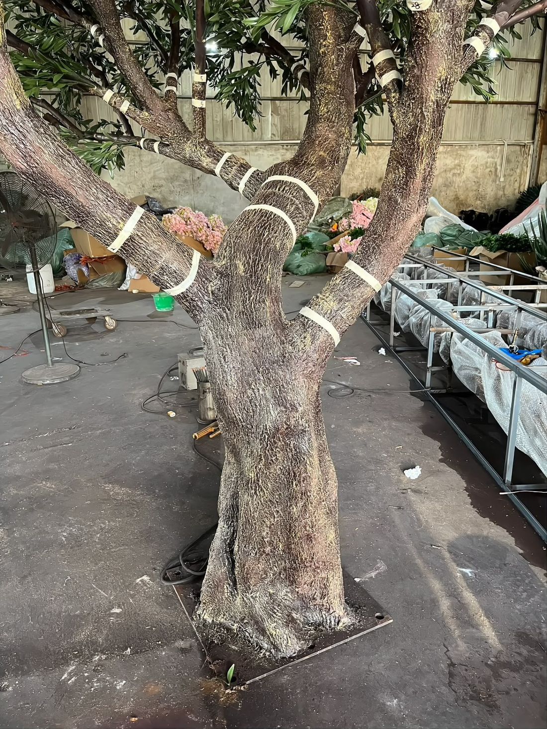 Hand-finished fibreglass bark — every trunk is textured and painted by hand