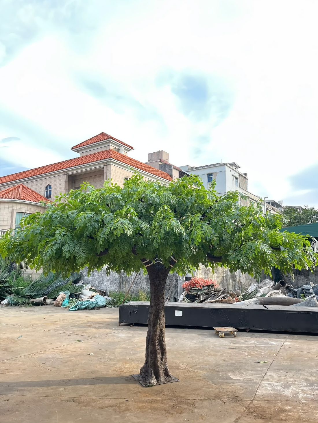 Outdoor-grade tree in the yard — UV-stabilised foliage before dispatch