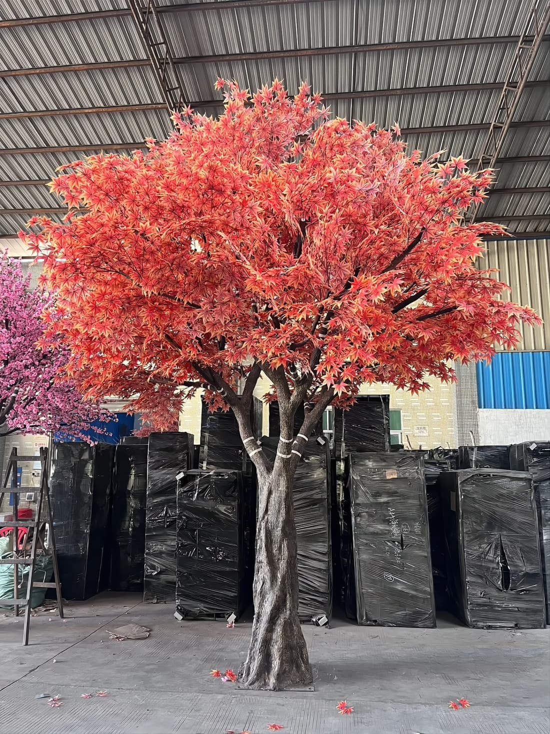 Packaging bay with finished artificial plants staged and wrapped ready for export shipment
