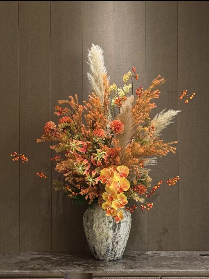 Artificial floral arrangement in vase, hotel lobby display photo